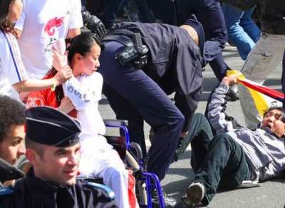 Paris: after a protestor tried to take the torch from a torchbearer in a wheelchair.